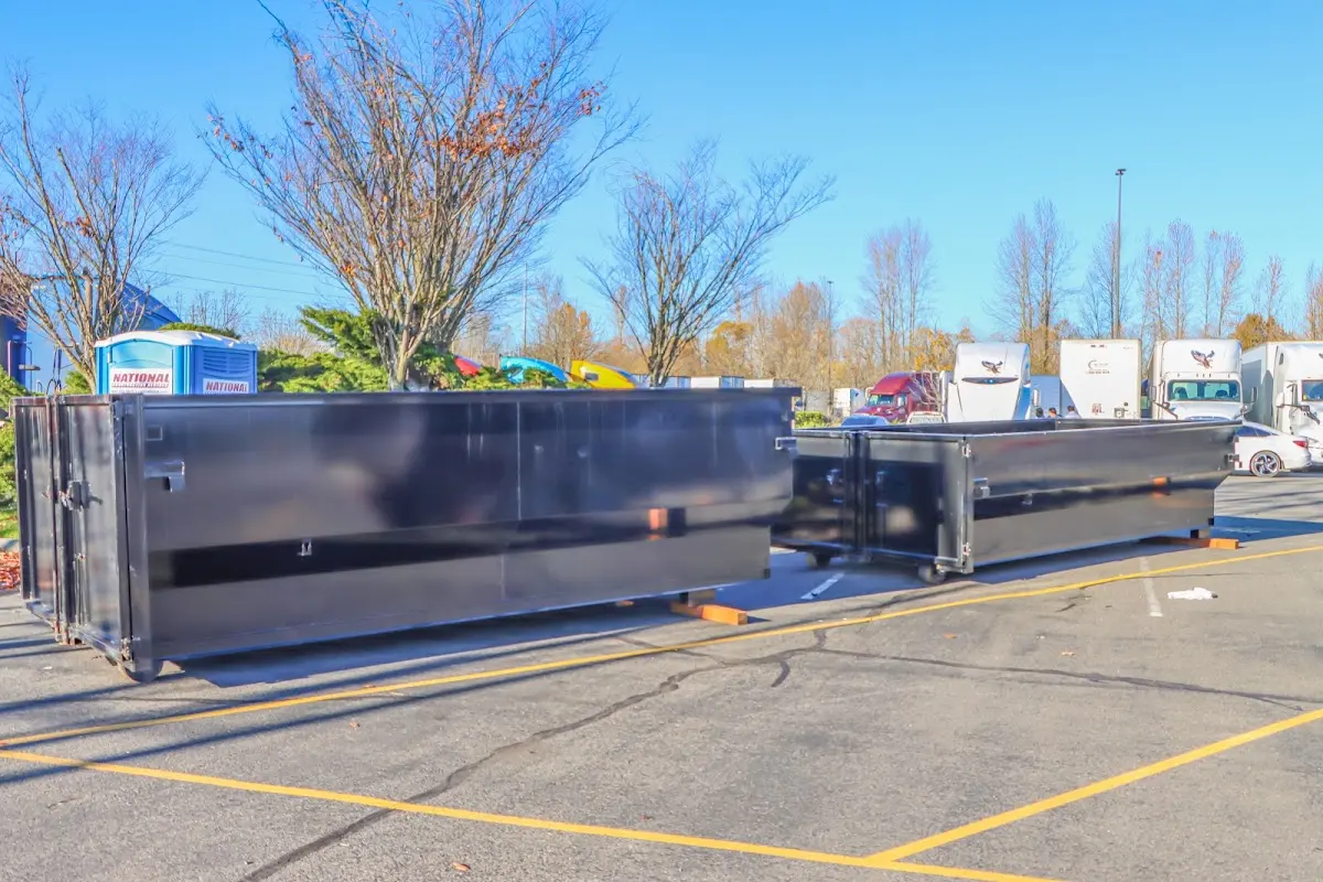 Professional dumpster rental service with roll-off container on residential driveway in Naperville